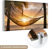 MuchoWow® Glasschilderij 80x40 cm - Schilderij acrylglas - Hangmat op strand tijdens zonsondergang in Jamaica - Foto op glas - Schilderijen
