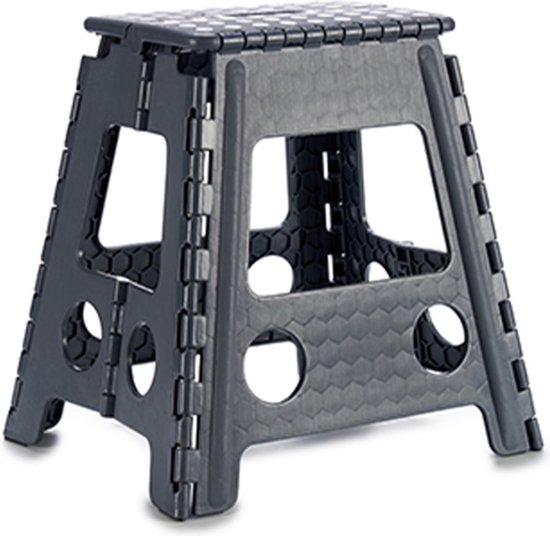 Tabouret pliant gris foncé avec structure en nid d'abeille, côtés ouverts et dessus antidérapant.