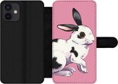 Bookcase Geschikt voor iPhone 12 telefoonhoesje - Konijn met roze achtergrond - Met vakjes - Wallet case met magneetsluiting