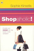 Boekomslag met de titel Shopaholic! van Sophie Kinsella. Een vrouw draagt boodschappentassen, een witte jas en zonnebril.