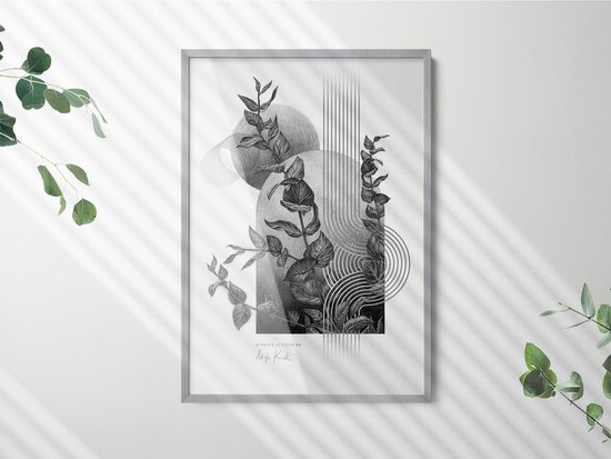 Cadre photo gris avec une illustration abstraite de branches et de formes géométriques. Accroché à un mur blanc avec des ombres de feuilles.