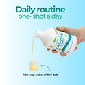 Een hand schenkt gele vloeistof uit een fles CAL-MAG 33 SHOTS in een dopje. Tekst: 'Daily routine one-shot a day.'