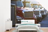 Behang - Fotobehang Shot van vrachtwagens naast elkaar - Breedte 305 cm x hoogte 220 cm