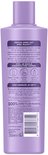 Achterkant van paarse fles Andrélon Oil & Care shampoo, met productinformatie en ingrediëntenlijst.