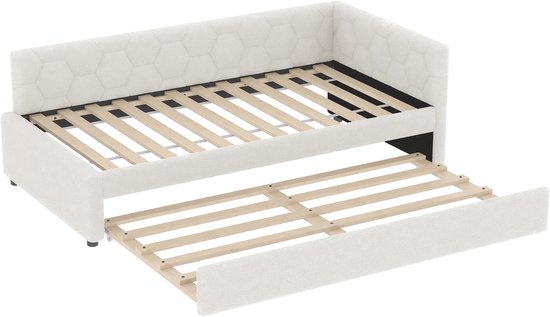 Witte slaapbank met uitschuifbaar bed, hexagonaal patroon op de rugleuning, geïsoleerde weergave.