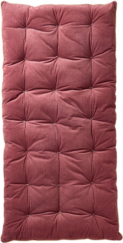 Lichtroze corduroy vloermatras met een goudkleurige bies.
