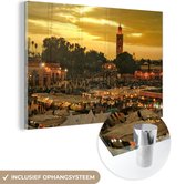 MuchoWow® Glasschilderij 180x120 cm - Schilderij acrylglas - Zonsondergang boven Djemaa El Fna in Marokko - Foto op glas - Schilderijen