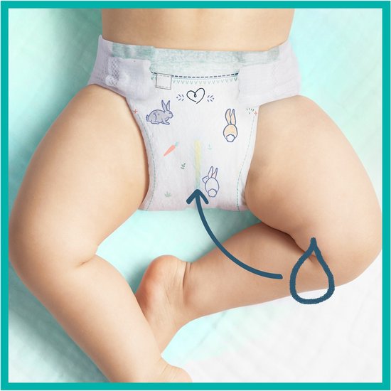 Gros plan des couches Pampers Harmonie taille 5, avec motifs de lapins et carottes. Une flèche montre le liquide.