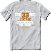 33 Jaar Legend T-Shirt | Goud - Wit | Grappig Verjaardag en Feest Cadeau Shirt | Dames - Heren - Unisex | Tshirt Kleding Kado | - Licht Grijs - Gemaleerd - S