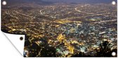 Schuttingposter Luchtfoto van Bogota in Colombia in de nacht - 200x100 cm - Tuindoek