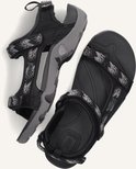 Zwarte Teva sandalen met grijs en zwart camouflagepatroon op de bandjes en een grijze zool.
