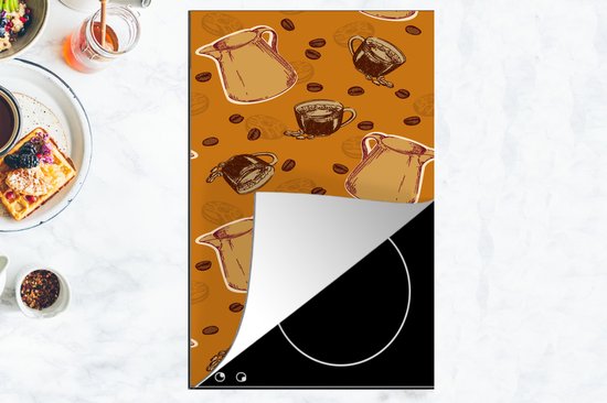 Kookplaatbeschermer met koffiepatroon, geplaatst op een inductiekookplaat.