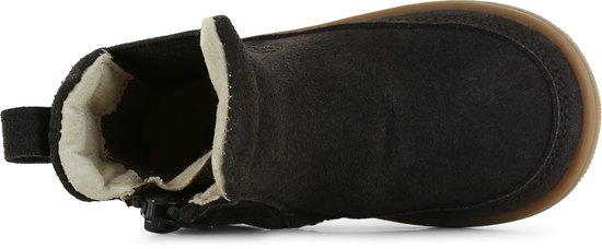 Bovenaanzicht van een donkerbruine suède chelseaboots met rits.