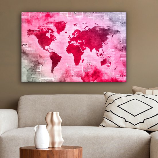 Wereldkaart avec peinture rose vif sur fond avec journal 90x60 cm