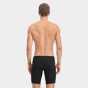 Man in zwarte Puma boxershorts, van achteren. Tailleband met herhalende PUMA-print.