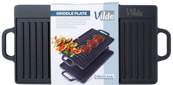 Zwarte gietijzeren grillplaat, 50x23,5 cm, met Vilde-logo en verpakking met afbeelding van gegrild vlees en groenten.