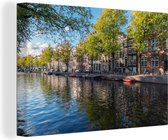 Canvas schilderij 140x90 cm - Wanddecoratie De Prinsengracht in het centrum van Amsterdam - Muurdecoratie woonkamer - Slaapkamer decoratie - Kamer accessoires - Schilderijen