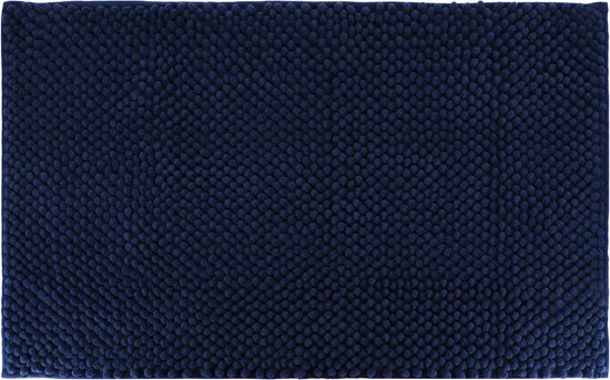 Donkerblauwe badmat met een textuur van dicht op elkaar staande bolletjes.