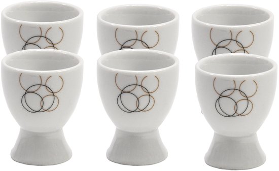 Set van 6 witte eierdopjes met zwarte en gouden cirkels, in retro design.