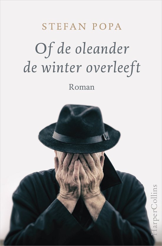 Boekomslag 'Of de oleander de winter overleeft', roman, met man met hoed die gezicht bedekt.