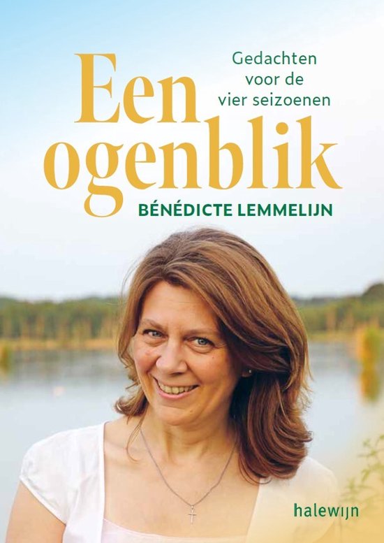 Boek "Een ogenblik" met een glimlachende vrouw met bruin haar en een witte top. Op de achtergrond een meer en bomen.
