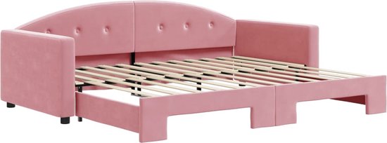 Roze fluwelen slaapbank met capitonnage en uitschuifbaar onderschuifbed.