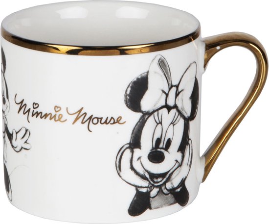 Mug blanc avec illustration de Minnie Mouse à l'encre noire, bordure et anse dorées, texte 'Minnie Mouse' doré.
