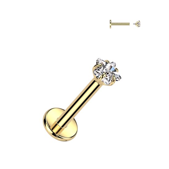 Gouden labret piercing met een ster van transparante steentjes aan de bovenkant.