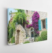 Vibrant green ivy and purple flowers grow over a medieval stone building in France.- Modern Art Canvas - Horizontal - 1406601515 - 115*75 Horizontal