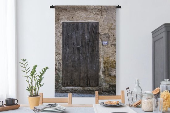 Tapisserie Porte - Une vieille porte en bois près d'un vieux mur en Italie  Toscane... | bol
