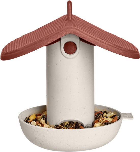 Elho vogelvoederhuis met rood dak en beige gespikkelde houder gevuld met vogelzaad en noten.