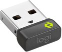 Kleine zwarte Logi USB-ontvanger met een groen icoon en zilverkleurige connector.