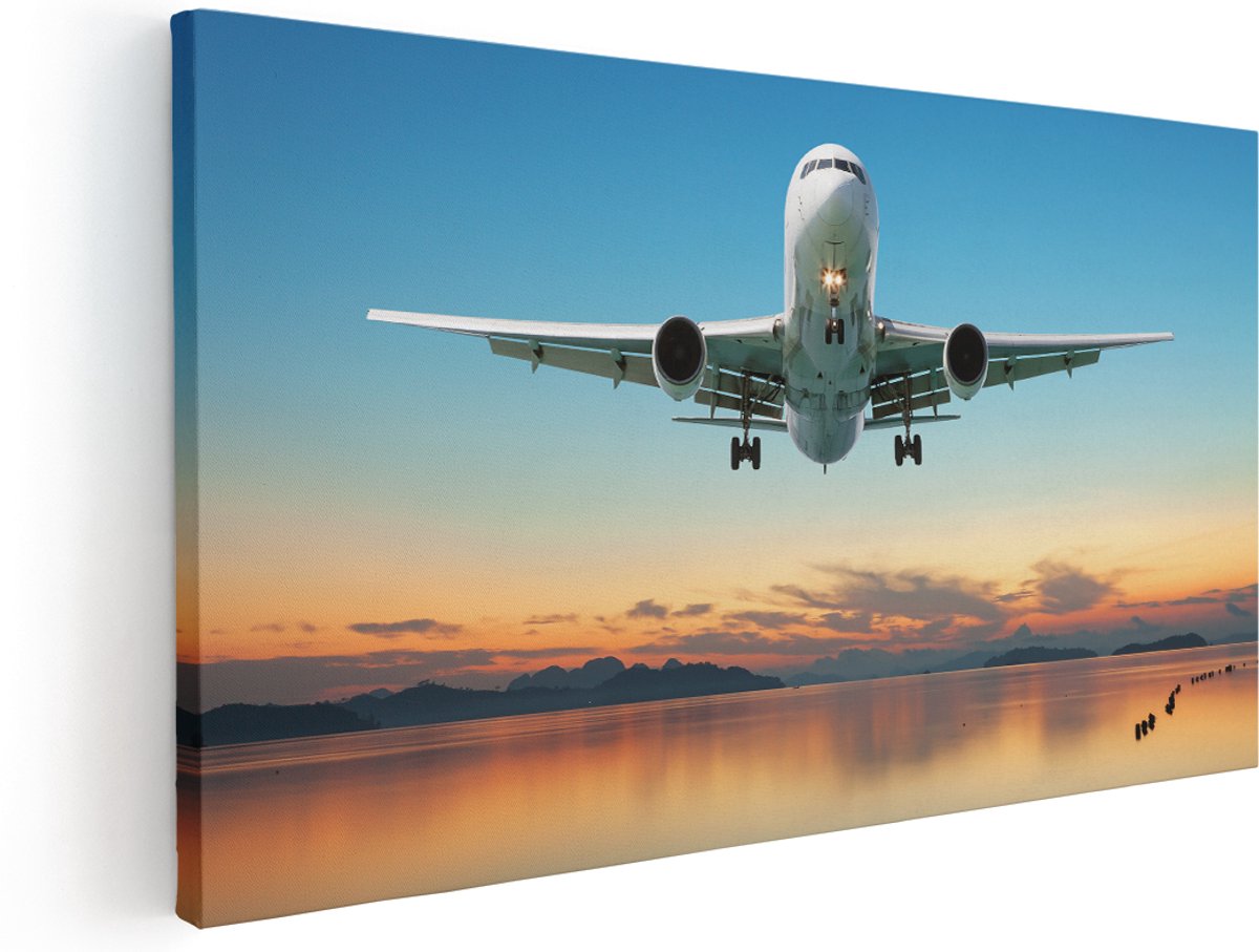 Artaza Canvas Schilderij Vliegtuig Vliegt Boven Een Kleurrijke Zee - 180x90 cm - Groot - Wanddecoratie Woonkamer - Schilderijen - Muurdecoratie