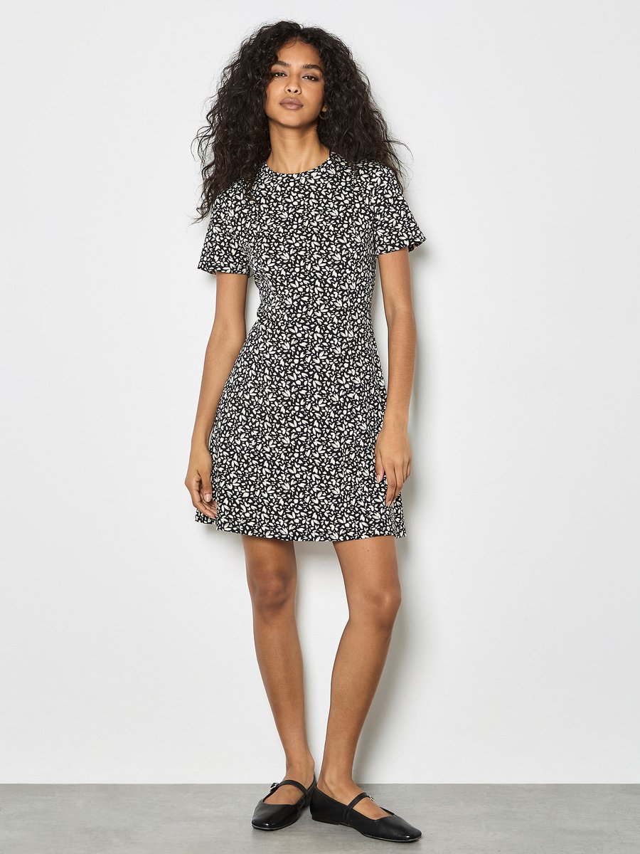 Jersey mini-jurk met bloemblaadjesprint