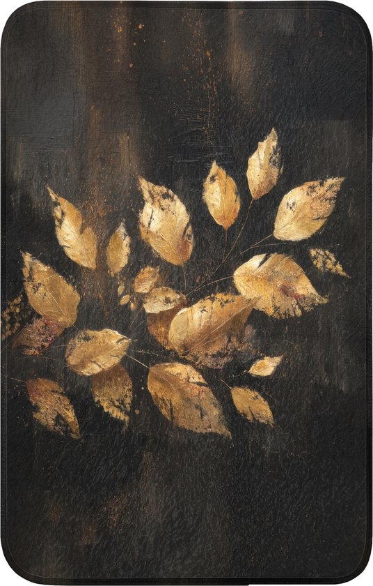 Tapis de bain noir avec un gros plan d'un imprimé de feuilles dorées.