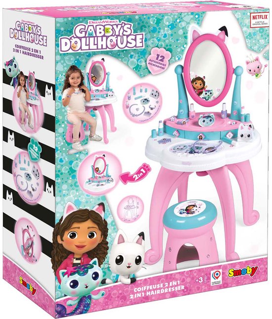 Doos met Gabby's Dollhouse 2-in-1 kaptafel met spiegel, krukje, make-up en accessoires.