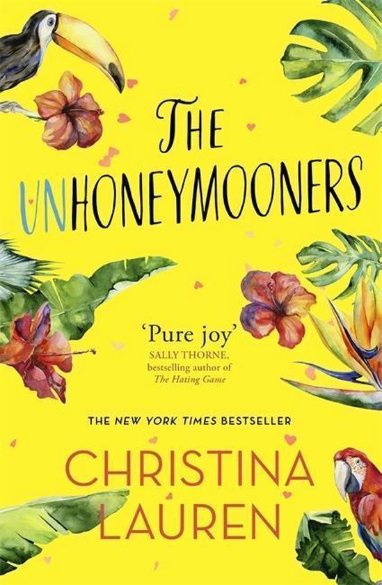 Boekomslag van The Unhoneymooners met toekan, papegaai, tropische bloemen en bladeren op een gele achtergrond.