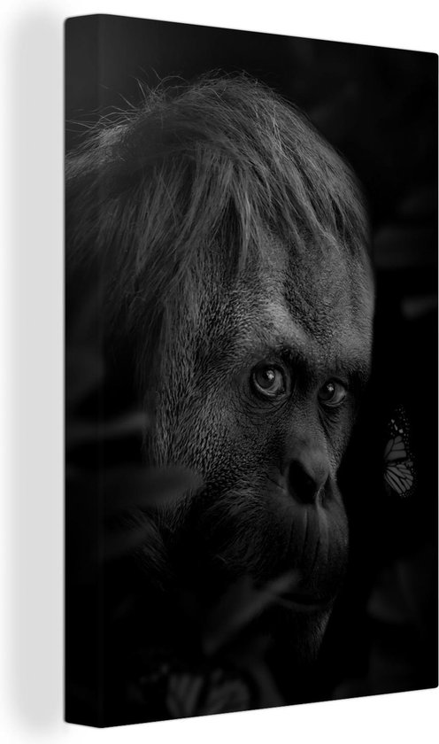 Canvas schilderij 90x140 cm - Wanddecoratie Close-up van een aap in de jungle - zwart wit - Muurdecoratie woonkamer - Slaapkamer decoratie - Kamer accessoires - Schilderijen