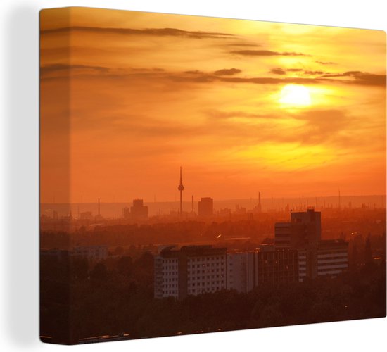 Canvas schilderij 160x120 cm - Wanddecoratie De ondergaande zon boven de skyline van het Duitse Mannheim - Muurdecoratie woonkamer - Slaapkamer decoratie - Kamer accessoires - Schilderijen