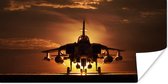 Poster Een silhouet van een straaljager tijdens een zonsondergang - 120x60 cm