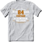 84 Jaar Legend T-Shirt | Goud - Wit | Grappig Verjaardag en Feest Cadeau Shirt | Dames - Heren - Unisex | Tshirt Kleding Kado | - Licht Grijs - Gemaleerd - S