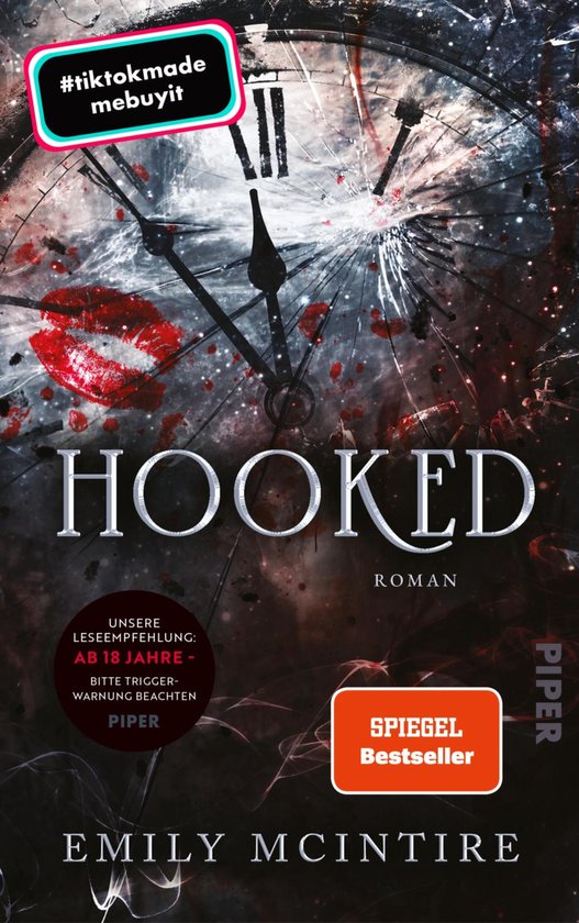 Couverture de livre avec une horloge brisée, un baiser de rouge à lèvres rouge et le texte 'HOOKED ROMAN Emily McIntire'. 'SPIEGEL Bestseller'.