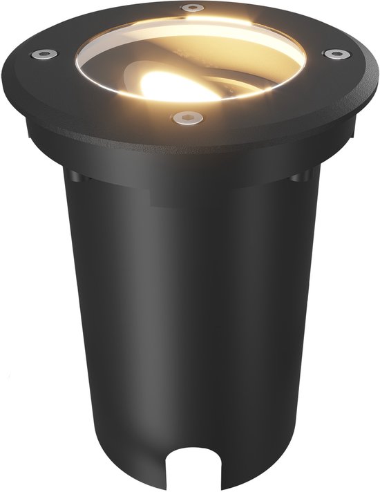 Zwarte LED grondspot, ingebouwd in de grond, met warm licht.