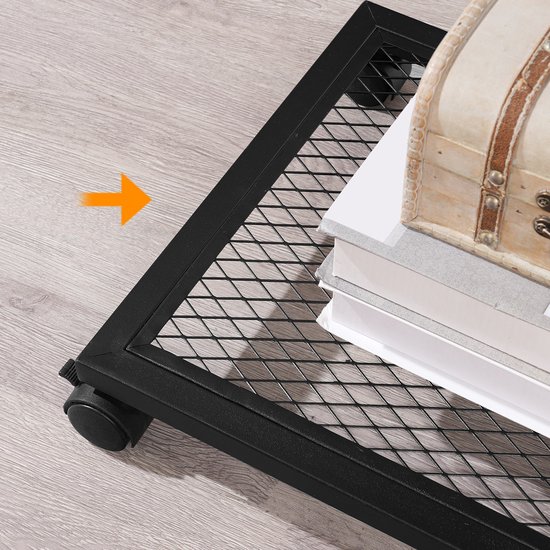 Detail van de onderste netwerkplank van een bijzettafel met wieltjes, met een schatkist en boeken.