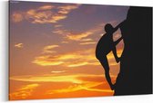 Schilderij - Rotsklimmer bij zonsondergang — 100x70 cm