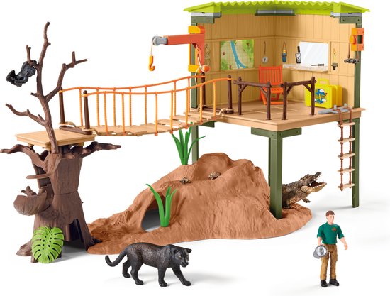 Gedetailleerd speelgoed avonturenstation met een klimboom, hangbrug, grot, krokodil, panter, gorilla, verzorger en schildpadden.