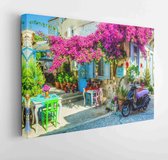 Alacati, Turkey - June 07, 2014 : Street view in Alacati, Turkey. Alacati, well known for its architecture, vineyards and windmills is a popular summer tourist destination,  - Mode