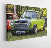 PRAGUE, CZECH REPUBLIC - JUNE 10th 2017: Old Mini Cooper car made to look like Mr. Bean's on display during annual Legendy car show on 10th April 2017 in Prague, CZE.  - Modern Art