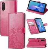Voor Sony Xperia 10 III Vierbladige Sluiting Reliëf Gesp Mobiele Telefoon Bescherming Lederen Case met Lanyard & Card Slot & Portemonnee & Beugel Functie (Magenta)
