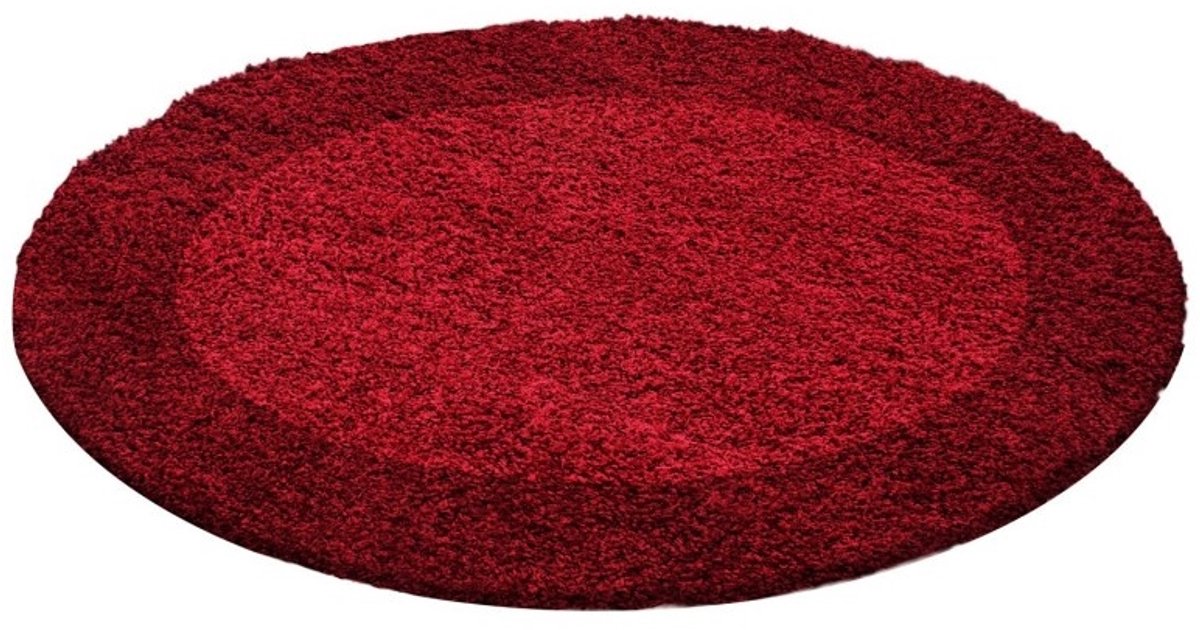 Hoogpolig vloerkleed met randafwerking, rode kleur, geschikt voor de woonkamer, met jute achterkant, rond formaat: 120 cm.